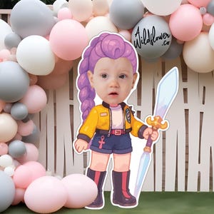 May include: A cartoon cutout of a child with purple hair, wearing a yellow jacket, blue shorts, and holding a sword. The background features a balloon arch in shades of pink, white, and gray, with the text "Wildflower .co" on a balloon.