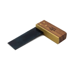 May include: A wooden and brass try square with a black metal blade. The square is labelled "MARPLES" and "Made in Japan".