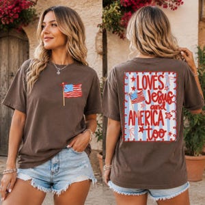 A woman wearing a brown t-shirt with an American flag design and text on the back.