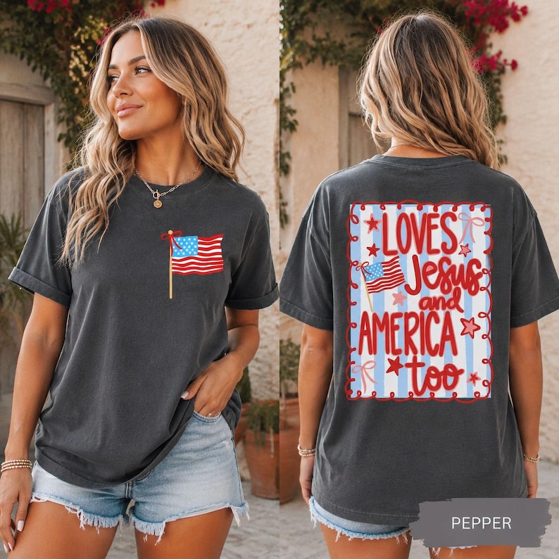 A woman wearing a black t-shirt with an American flag design and text on the back.