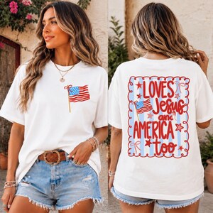 A woman wearing a white t-shirt with an American flag design and text on the back.