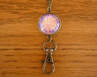 Mosaic Sunburst with blue background,  lanyard pendant, 20 mm glass charm, brass frame and spring clip, with 28" brass chain