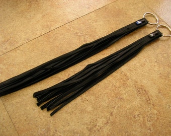 One black Leather tassel keychain with a handmade Peruvian Ceramic guitar bead, and a silver bead, on a 1" silver keyring