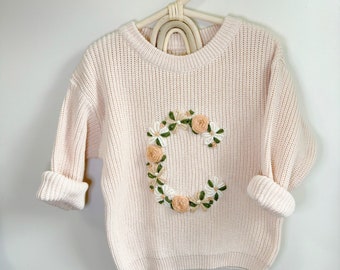 Floral letter design sweater