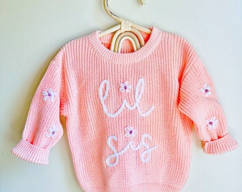 Hand embroidered baby announcement knit sweater