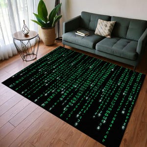May include: A black and green area rug with a repeating pattern of green code on a black background. The rug is in a living room setting with a dark green sofa and a side table.