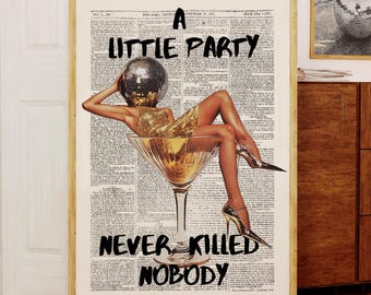 May include: A framed art print with the text "A Little Party Never Killed Nobody." The artwork features a woman in a gold dress and a disco ball head, inside a martini glass. Two other framed prints are visible in the background.