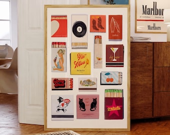 May include: A framed collage of vintage matchbox labels with various designs, including a heart, a record, cowboy boots, a surfboard, a martini glass, a cherry, a cat, and a star. The labels are arranged in a grid pattern on a white background.