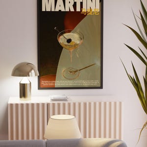 May include: A vintage poster advertising Martini, a classic cocktail. The poster features a martini glass with an olive and a stirrer, set against a colorful background. The text "MARTINI" is in bold white letters, with the Japanese characters for "Martini" in gold below.