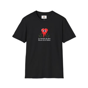 May include: Black t-shirt with a red heart dripping with blood and an eye inside. The text "La Saudade Se Vê Uma Ulerna Em Si Alma" is printed below the heart.