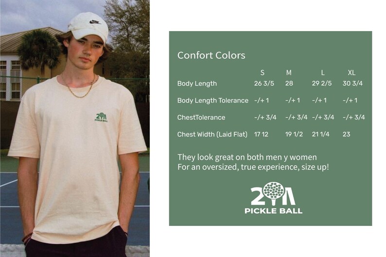 May include: A person wearing a cream-colored t-shirt with a small green pickleball logo. The shirt has a crew neck and short sleeves. The image also includes a size chart with measurements in inches and the text "21 Pickle Ball".