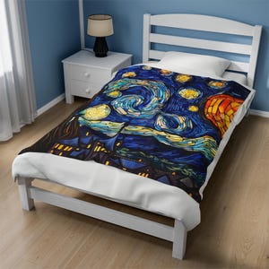 May include: A white twin-sized bed with a blue, yellow, and orange stained glass style duvet cover featuring a starry night scene with a swirling sky and a town in the distance.