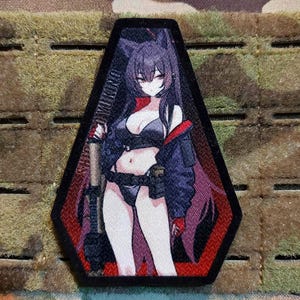 May include: A black and red embroidered patch featuring an anime-style illustration of a woman with purple hair and a black outfit. The patch has the text "SHIKIKAN WUKONG" and is set against a camouflage background.