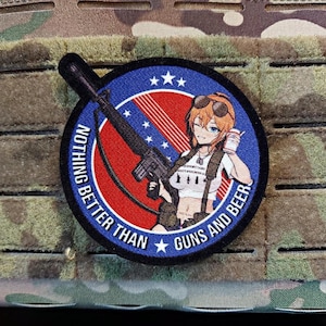 May include: A circular patch with a blue border and the text "NOTHING BETTER THAN GUNS AND BEER." The patch features an anime-style character holding a drink and a rifle, set against a red and white background with stars.
