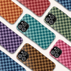 May include: A collection of phone cases with a checkered pattern in various colors, including orange, red, teal, green, purple, brown, blue, and pink. The cases have a glossy finish and a camera cutout.