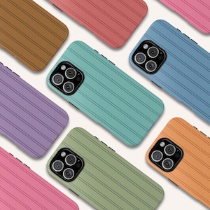 May include: A collection of colorful phone cases with a striped design. The cases are in various colors, including pink, purple, green, blue, orange, brown, and red. Each case has a camera module with three lenses.