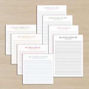 May include: A collection of lined notepads with various professional titles printed in different colors. Titles include: Pediatric Physician Assistant, Business Consultant, Physical Therapist, Critical Care Nurse, Accounting Consultant, Family Medicine, Math Teacher, and Special Education Teacher.