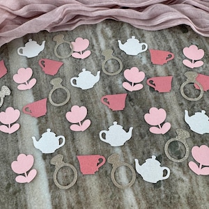 May include: Pink and white confetti with teacup, teapot, flower, and ring designs. The confetti is perfect for a bridal shower or tea party.