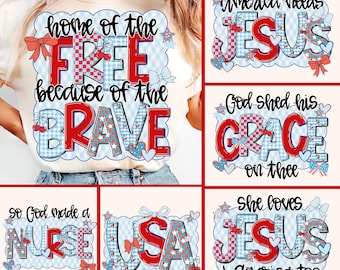 May include: A cream-colored t-shirt featuring patriotic text designs in red, white, and blue. The shirt displays phrases like "Home of the Free Because of the Brave" and "America Needs Jesus," with decorative elements such as bows, stars, and hearts.