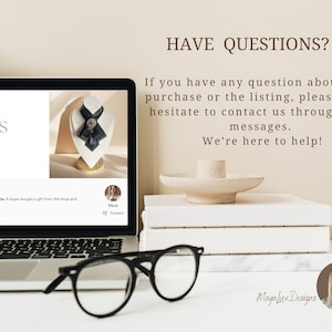 May include: A laptop displays a jewelry listing with a black and gray neck accessory on a mannequin. The text "TIMELESS ACCESSORIES" is visible. The image also shows a stack of white books, a decorative object, and black-framed glasses.