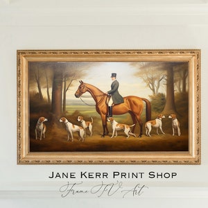 May include: A framed oil painting depicting a man on horseback riding through a forest with five hounds. The painting is set against a backdrop of trees and a distant landscape. The man is wearing a black top hat and a green jacket. The horse is brown and the hounds are white and brown.