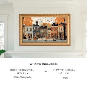 May include: A digital illustration of a quaint town street scene with colorful buildings, trees, and people walking. The buildings have a fall theme with orange and yellow leaves. The illustration is framed in a gold frame.