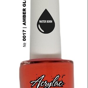 May include: A bottle of water-based acrylic paint in a bright orange color. The bottle is labeled "No. 0017 | AMBER GLOW" and "WATER BORN".