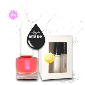 May include: A bottle of pink acrylic water-based nail polish with a black label that says "Acrylic Water Born". The bottle is sitting on a white surface with a white box behind it. The box has a window that shows two small bottles of clear nail polish. The box also has a yellow sticker that says "Free Samples".