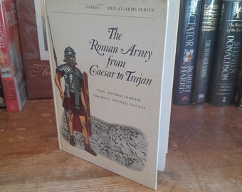 The Roman Army from Caesar to Trajan (Men at Arms) by Michael Simkins and Michael Youens. First Edition/First Printing Hardback Book 1974