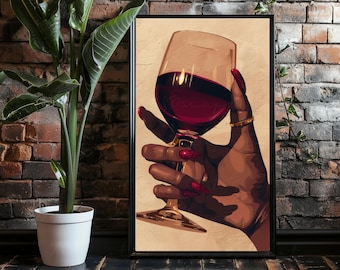 May include: A framed art print featuring a hand holding a wine glass filled with red wine. The hand has long red nails and a gold ring. The background is a brick wall.