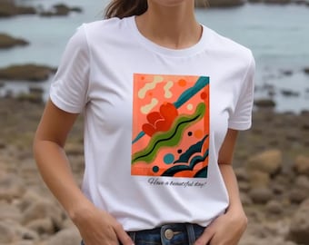 T-shirt grafica in cotone biologico: disegno astratto di mare e fiori