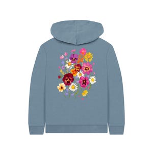 May include: A blue hoodie featuring a vibrant floral design on the back. The floral arrangement includes a variety of colorful flowers, such as pink, purple, yellow, and red blooms. The hoodie has a hood and long sleeves.