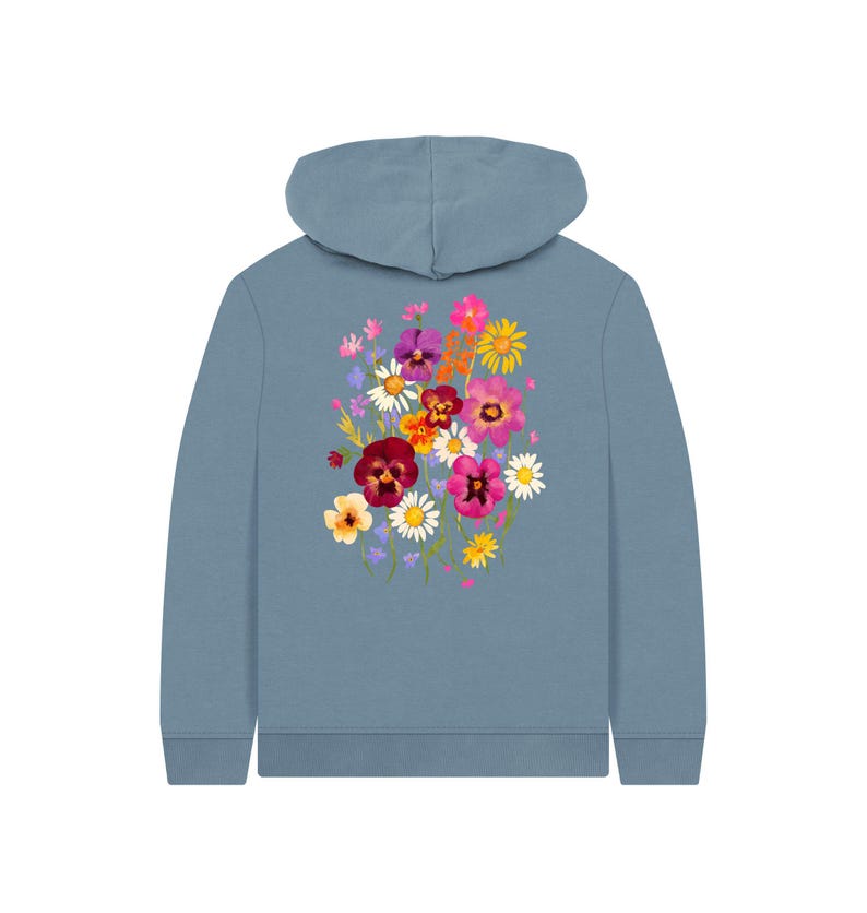 May include: A blue hoodie featuring a vibrant floral design on the back. The floral arrangement includes a variety of colorful flowers, such as pink, purple, yellow, and red blooms. The hoodie has a hood and long sleeves.