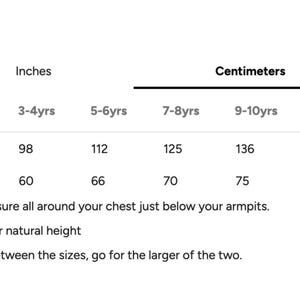 May include: A size chart with measurements in inches and centimeters for children's clothing. The chart includes height and chest measurements for ages 3-4 years through 11-12 years. Instructions are included.