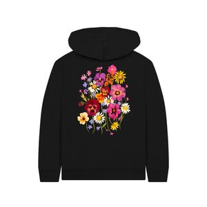 May include: Black hoodie featuring a vibrant floral design on the back. The colorful bouquet includes pink, purple, yellow, and white flowers. The hoodie has a drawstring hood and a kangaroo pocket.