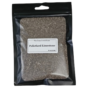 May include: A resealable plastic bag filled with small gray pelletized limestone. The bag has a label that reads "The Great Invertebrate Pelletized Limestone 4 ounces".