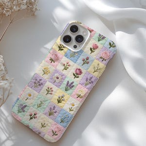 May include: A set of three ceramic mugs with a speckled, matte finish. The mugs are in shades of cream, light gray, and dark gray. Each mug has a simple, minimalist design and a rounded handle. The mugs are stacked on top of each other.