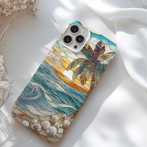 May include: A phone case with a stained glass design of a palm tree on a beach at sunset. The case has a blue, green, yellow, and orange color scheme.