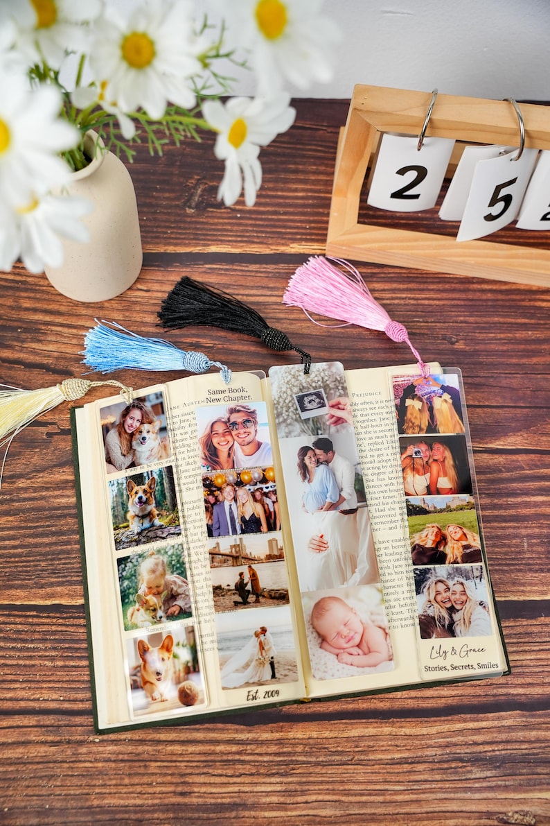 May include: Three clear acrylic bookmarks featuring photo collages and colorful tassels in light blue, black, and pink. The bookmarks display various personal photographs, including people, pets, and landscapes, with the text Lily & Grace Stories, Secrets, Smiles.
