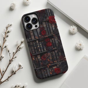 May include: A black phone case with a design of a bookshelf filled with books and red roses.