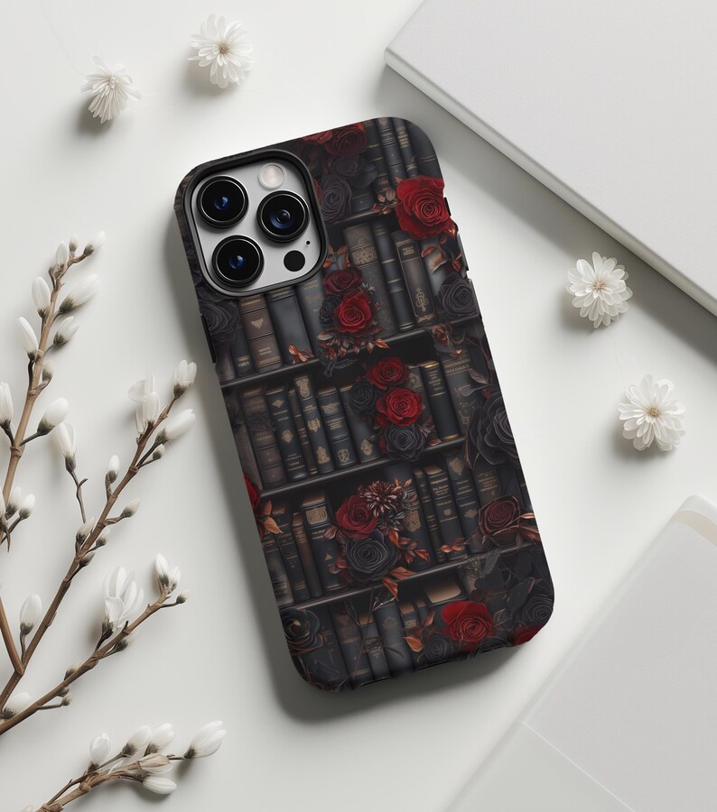 May include: A black phone case with a design of a bookshelf filled with books and red roses.