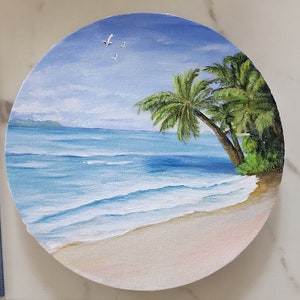 Acrylschilderij tropisch strand op een ronde cirkel van 8 inch. Het schilderij is op gespannen canvas op een frame van duurzaam mdf-karton.