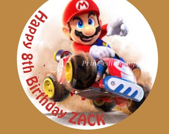 May include: Edible cake photo topper featuring a cartoon character in a red cap and blue overalls on a race kart. The text "Happy 8th Birthday ZACK" is displayed around the edge of the image.
