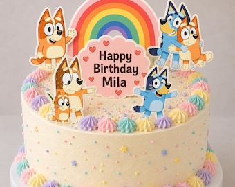 May include: A decorated birthday cake with cartoon character toppers. The cake is frosted in a light yellow color and adorned with pastel-colored frosting swirls. A rainbow and a sign that says "Happy Birthday Mila" are also on the cake.