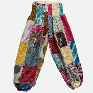 May include: A rustic wooden sign with the text "Welcome to our home" in white lettering. The sign features a distressed finish and a simple, inviting design, perfect for front door decor.