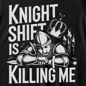 May include: Black t-shirt with a white graphic of a knight wearing a crown and holding a sword. The text "Knight Shift is Killing Me" is printed below the graphic.