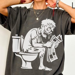 Zombie on Toilet T-Shirt, Funny Halloween Tee, Zombie Reading Newspaper, Undead, Horror Movie, Humor Shirt, Unique Gift Idea