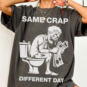 Camiseta divertida de zombies: Camiseta gráfica "La misma mierda, diferente día"