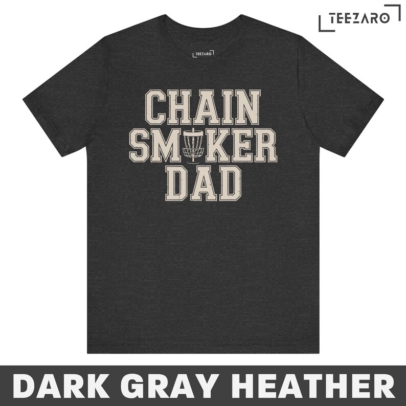May include: Dark gray heather t-shirt with the text "Chain Smoker Dad" in white with a disc golf disc graphic.