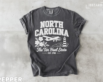 North Carolina T-Shirt: Airplane, Lighthouse & Dogwood Floral Design
